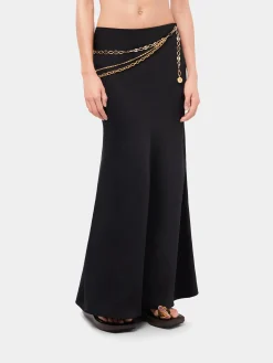 Long black skirt embellished with