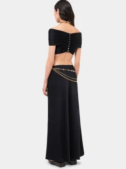 Long black skirt embellished with